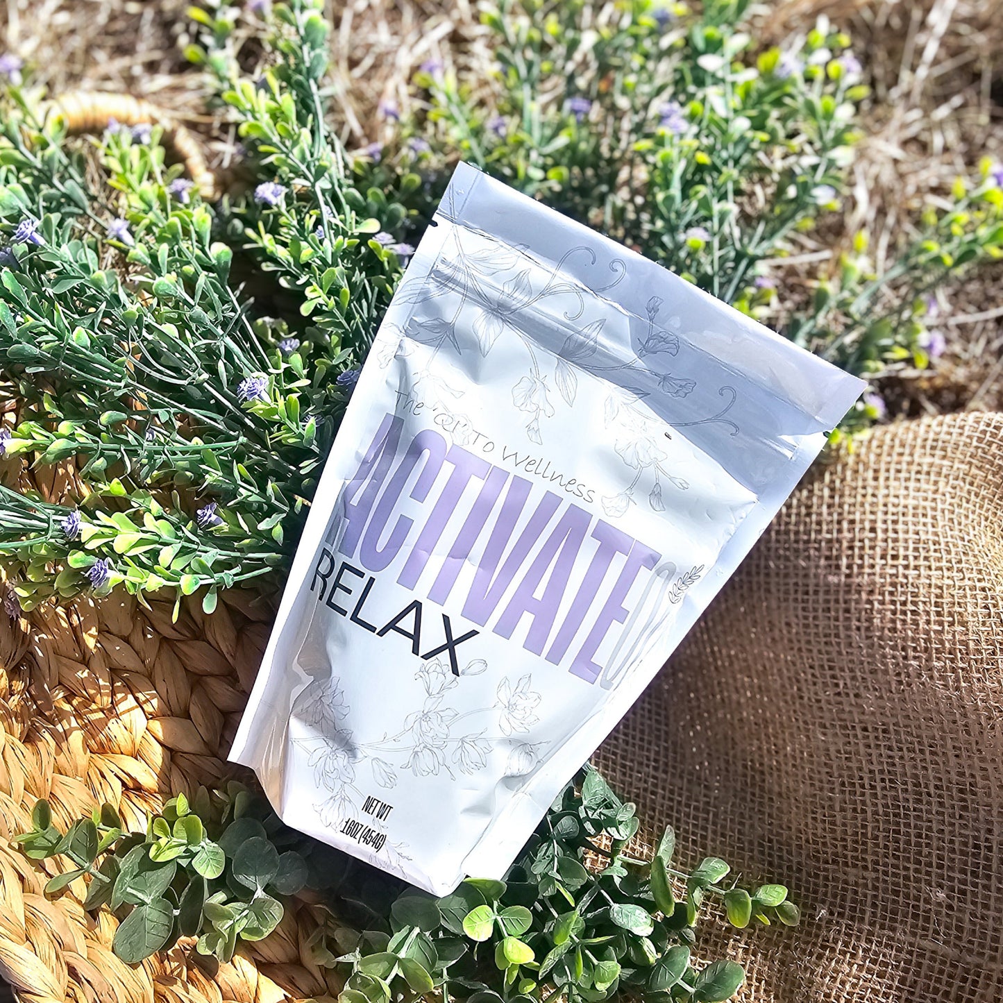 Package labeled 'Activate Relax' on a woven mat with plants