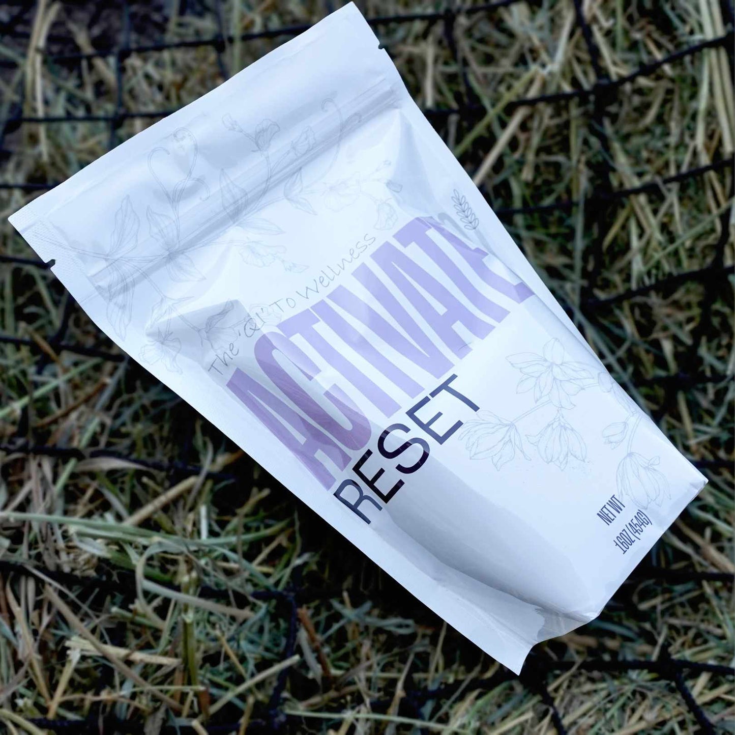 White package with 'Activate Reset' text on a grassy background