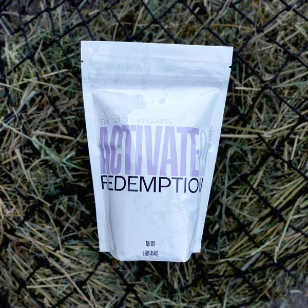 Bag of Redemption by ActivateQi laying on a hay net.
